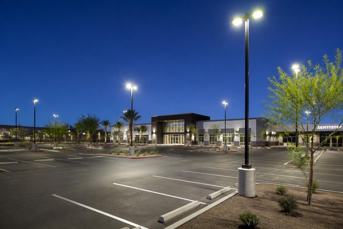 Well-lit commercial parking lot at dusk in Las Vegas with LED pole lights